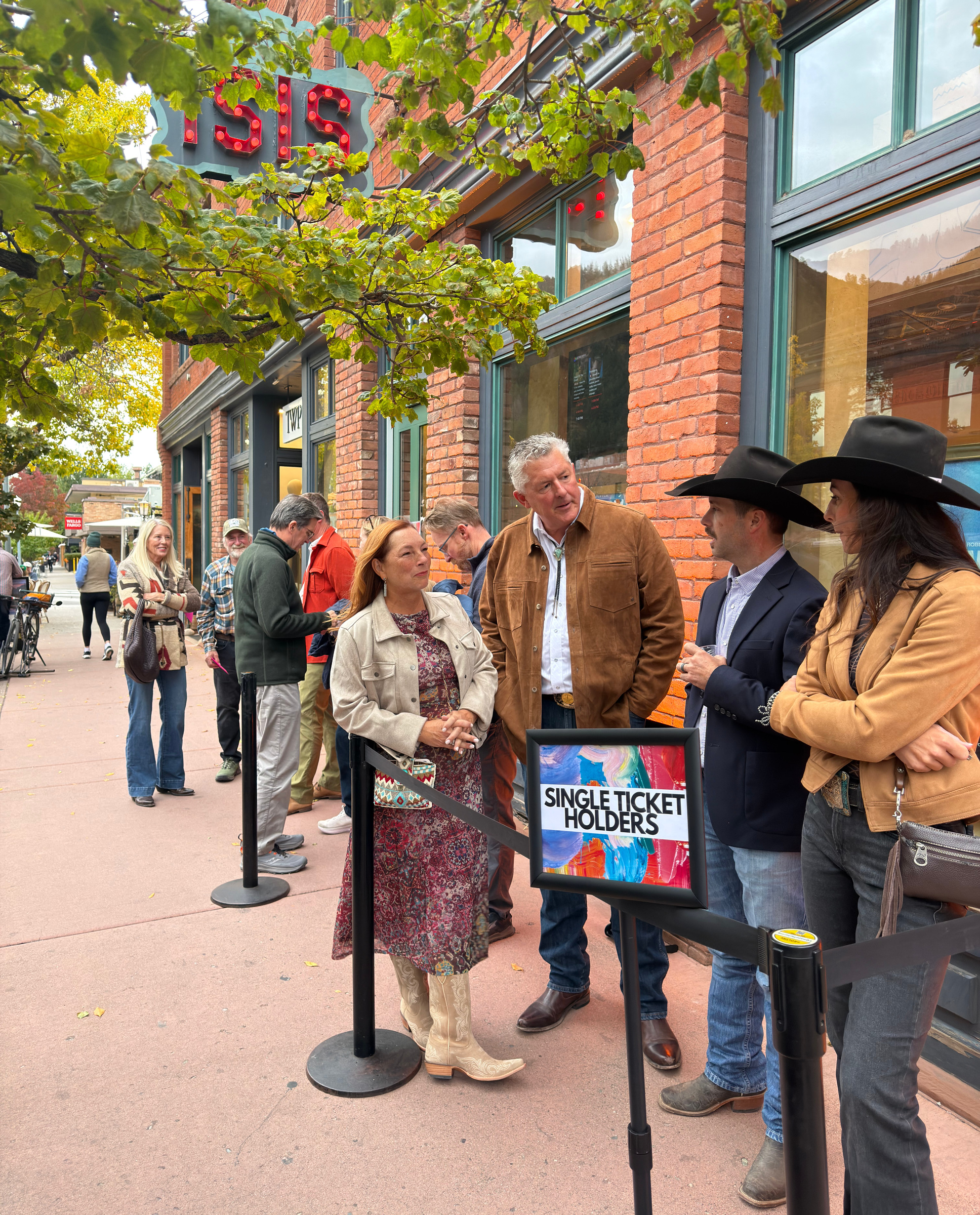 Festival guests in conversation outside a theatre