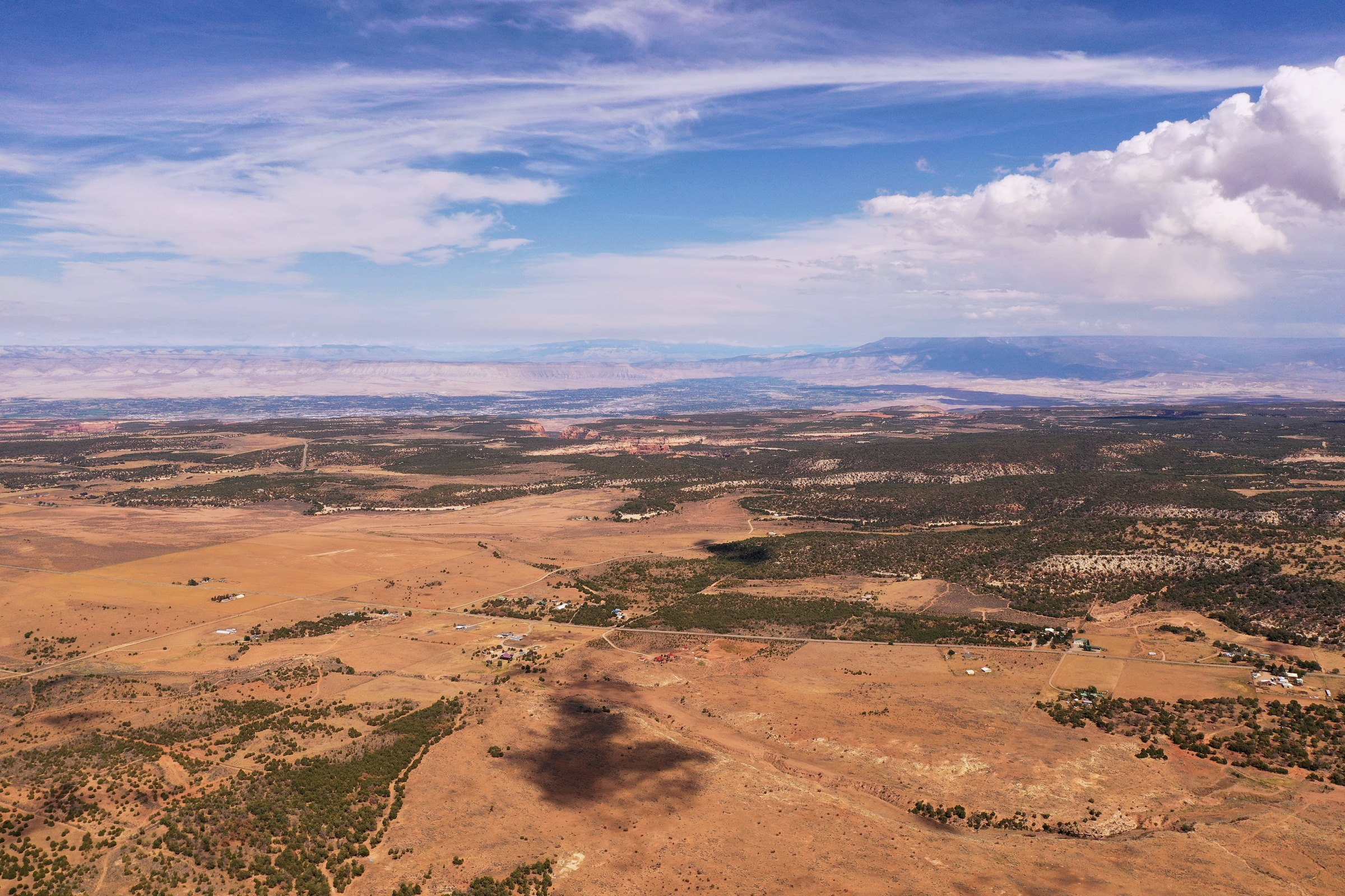 Wide aerial photograph of Glade Park land and surrounding mesas