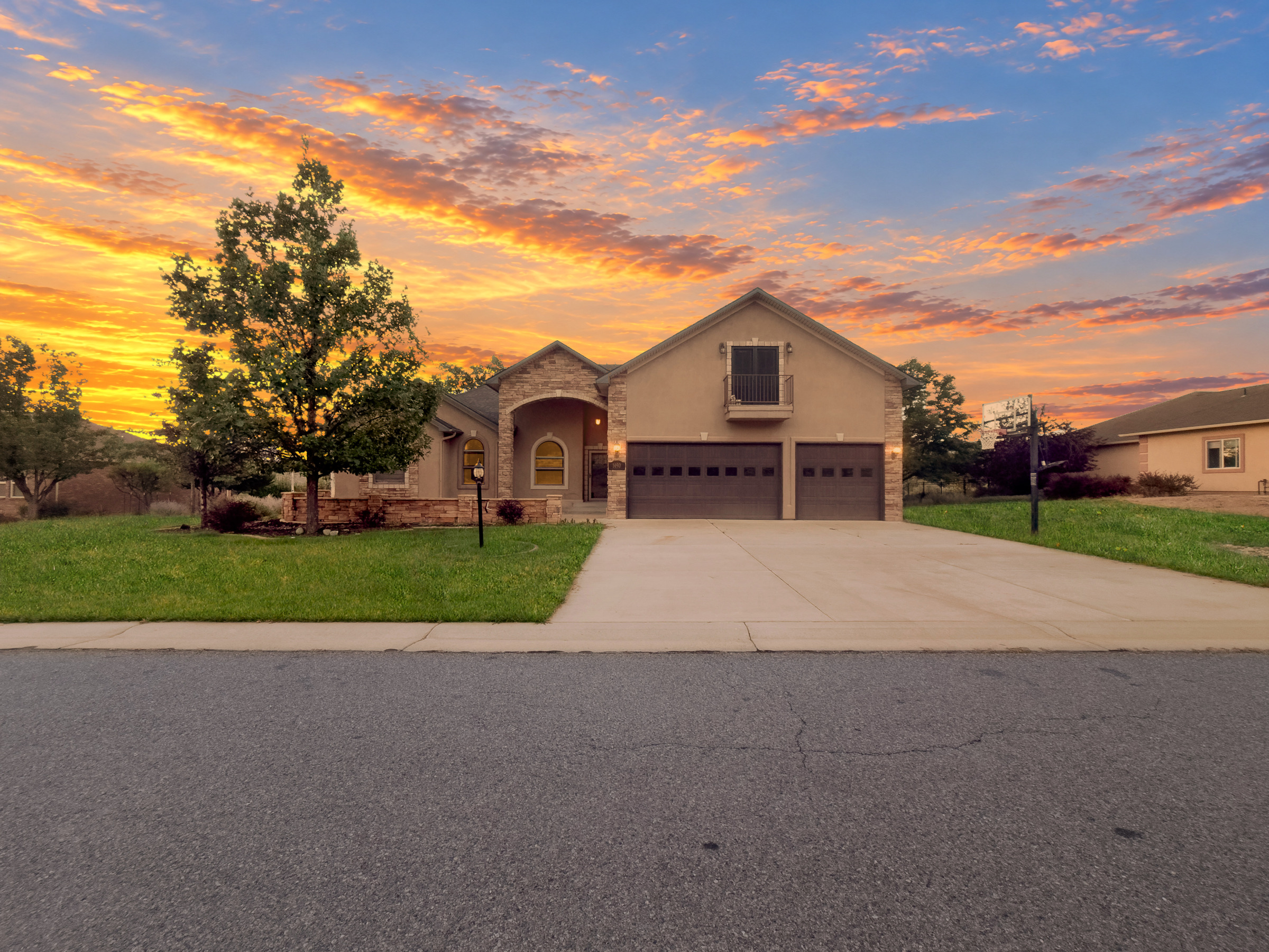 Home and lawn photographed at sunset