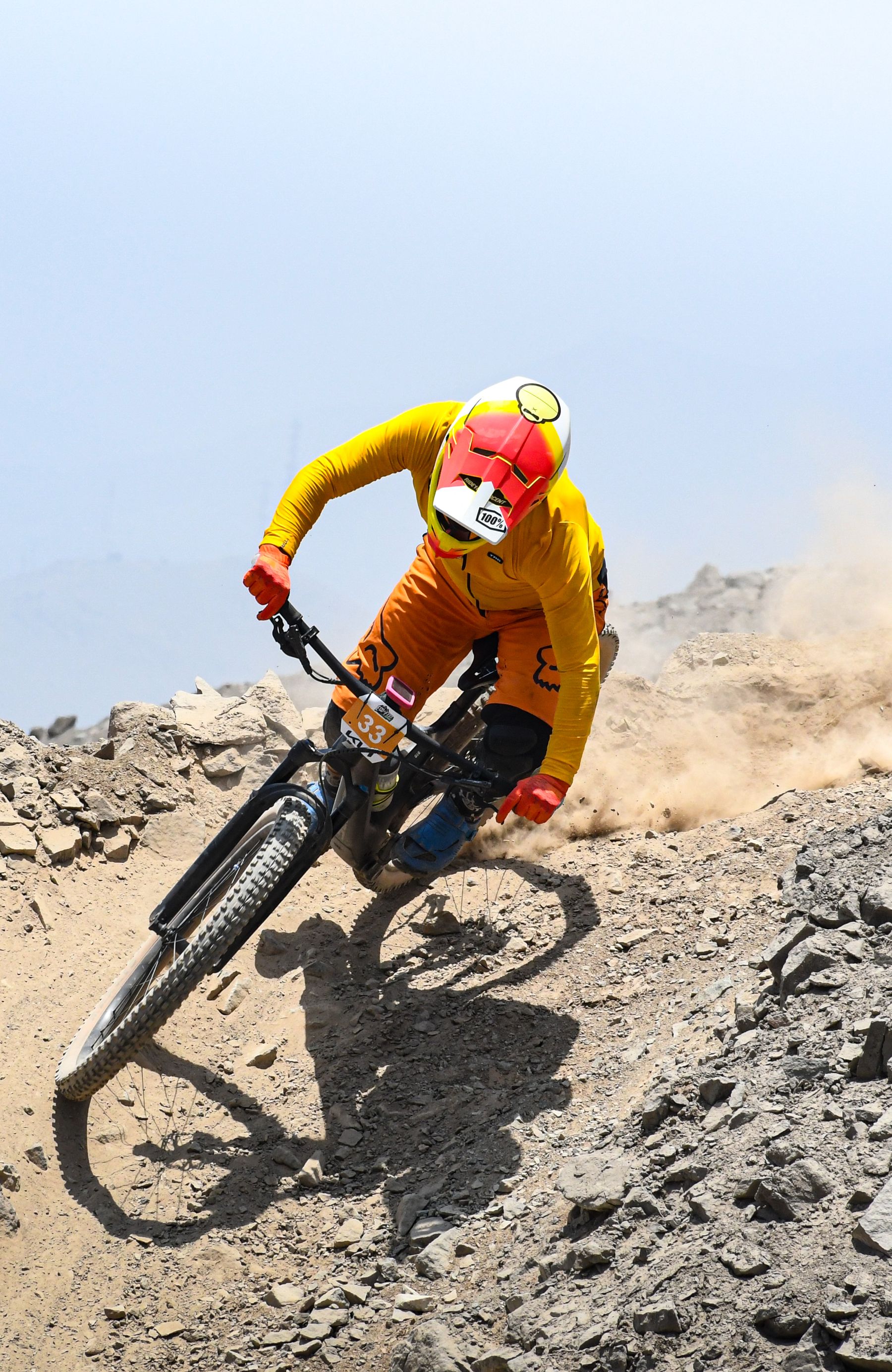 Mountain biker descending rocky terrain
